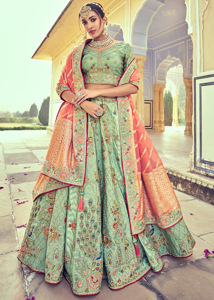 Woven zari Banarasi silk lehenga choli in Pista Green and Peach 6007 Desc:  Style : A-Line Lehenga Choli Color : Pista Green and Peach Fabric : Silk   Work : Heavy Jacquard Woven With Embroidery & Stone Work Wash Care : Dry clean Sleeve Style : Half Sleeve Long Sleeves : Done only in Custom Stitch Sleeves Lining : Done only in Custom Stitch Bust Size : 32 to 42 Inches Occasion : Wedding   Mehendi   Sangeet   Engagement   Reception   Ceremonial   Baby ShowerShop Banarasi lehenga,sil Choli Style, Saree Bridesmaid, My Daughter Quotes, Tulle Shawl, Saree South Indian, South Indian Saree, Bridal Lehenga Online, Short Blouse, Modern Indian Wedding