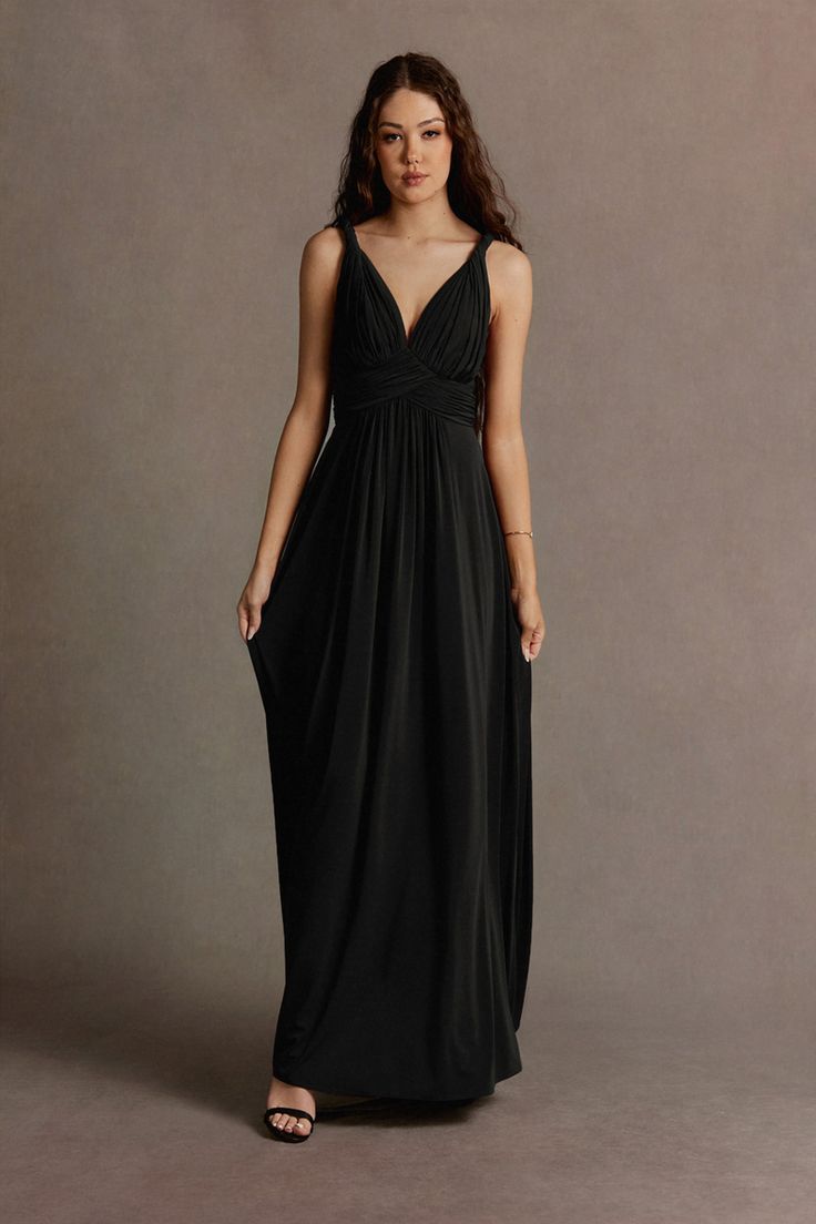 Step into the spotlight in our Maddie Twist Strap Maxi Dress. Made of luxe knit fabric, this chic style features a plunging neckline with romantic twists on the straps and an elegantly shaped A-line skirt exuding confidence and sophistication. The perfect "go-to" dress for any formal event. Black Maxi Dress With Adjustable Straps, Black Fitted Maxi Dress With Strappy Back, Black V-neck Maxi Dress With Fitted Bodice, Black V-neck Feminine Maxi Dress, Black V-neck Maxi Dress With Flattering Silhouette, Black Dress Formal, Plunging Neckline, Formal Event, A Line Skirts