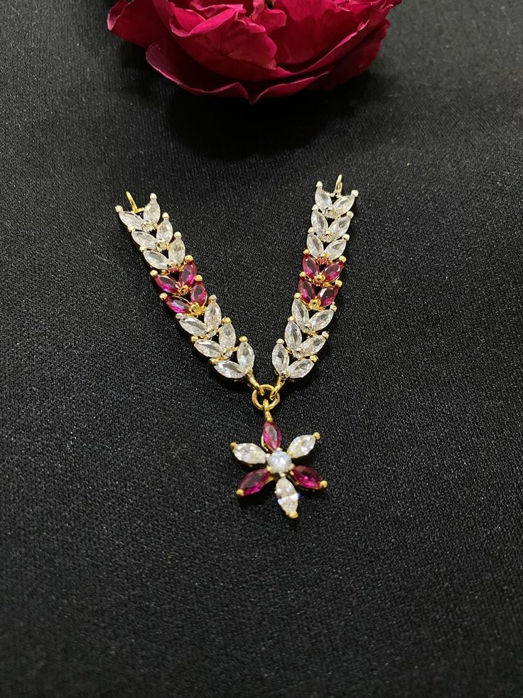 Polish 22k yellow gold plating  Stone simulated  White Cubic zirconia & ruby These are hand setting work ( Hand made with love for our laddu Gopal ji) Made by Ray fineornates Jewellery from India - for your every type of occasion and mood ✔ HIGH QUALITY~ We make everything by hand and pay extra attention to high-quality materials. Our products are all sanitised.   ✔ Dazzling~ Our handmade product bring you the superior feeling in every occasion, in the office or in the evening to go out, the min Traditional Cubic Zirconia Pendant Jewelry, Gold Gemstone Necklace With Cubic Zirconia, Red 22k Gold Necklace For Celebration, Yellow Gold Kundan Necklace Gift For Diwali, Yellow Gold Jewelry Sets For Diwali Gift, Yellow Gold Temple Jewelry With Cubic Zirconia, Diwali Gift Yellow Gold Jewelry Sets, Red Temple Necklace With Hand-set Detail As Gift, Ruby Jewelry Sets For Festivals And Gifts