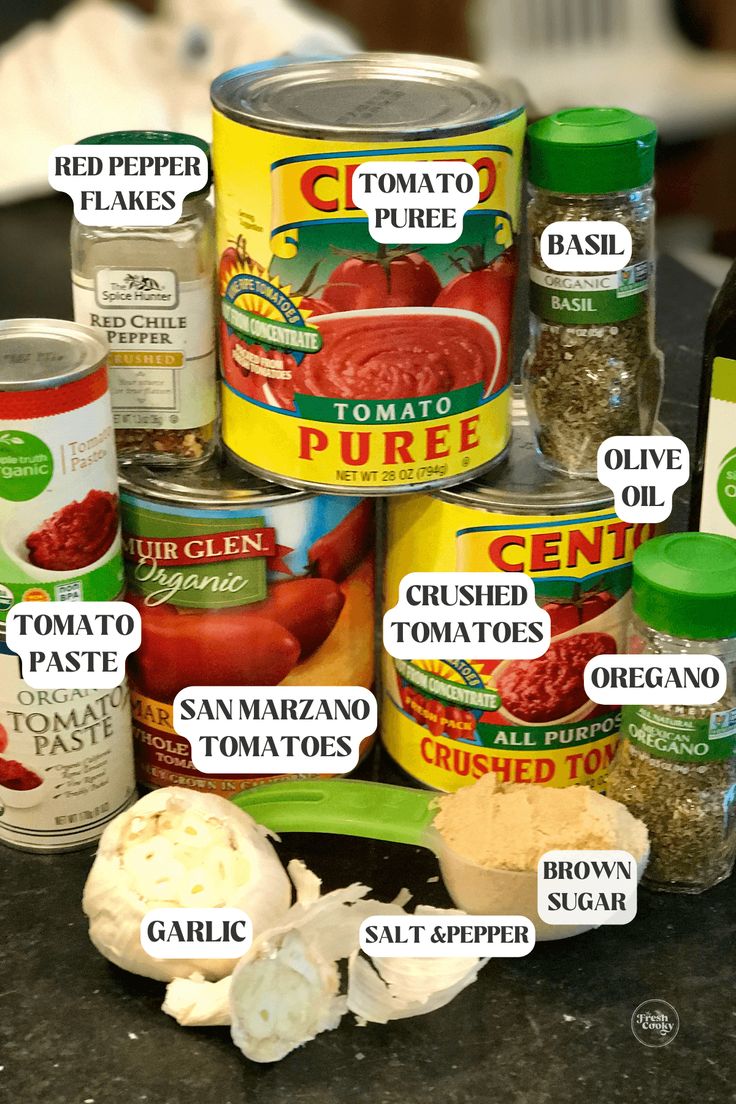 an image of canned food labeled in different languages on a table with other ingredients around it