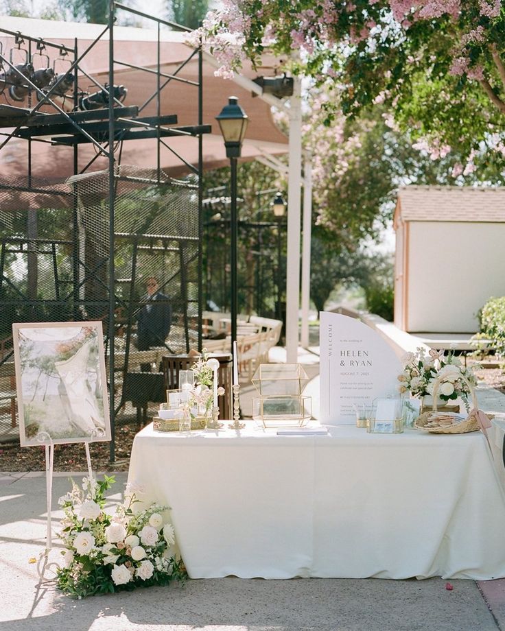 a table with flowers and pictures on it