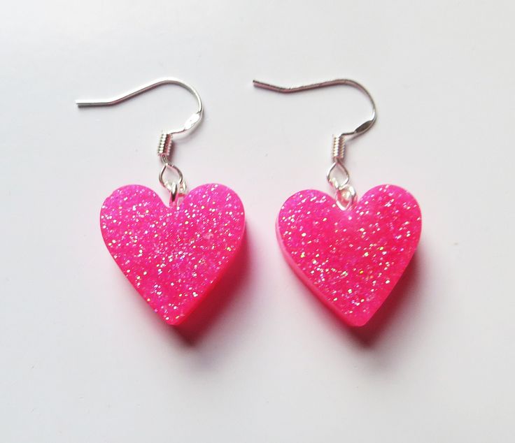 Cute small bright pink glitter heart earrings. Pink glitter sparkle hearts on silver fishook earrings posts. Pink Heart Cut Earrings For Party, Pink Heart-shaped Earrings For Party, Pink Double Heart Earrings For Party, Cute Pink Glitter Earrings, Pink Glitter Jewelry For Gift, Cute Pink Earrings With Heart Print, Pink Glitter Heart Earrings For Party, Pink Handmade Heart Earrings For Party, Pink Glitter Earrings For Valentine's Day