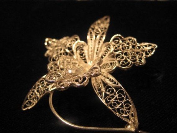 Brooch in silver filigree with goldplated center, handmaded in Italy, weight: 8 gr lenght: approximately 6 cm All items are handmade and personally designed. Custom orders are welcome! Elegant Gold Filigree Brooches, Formal Filigree Pendant Brooch, Gold Engraved Brooches For Gift, Gold Filigree Ornate Brooches, Gold Filigree Brooches As Gifts, Ornate Gold Filigree Brooches, Traditional Yellow Gold Brooches As Gifts, Unique Yellow Gold Brooches For Gifts, Handmade Victorian Brooches As Gifts