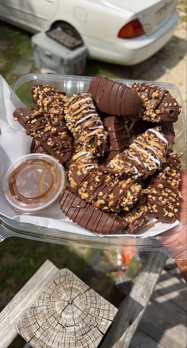 there is a platter of chocolate covered cookies on the table