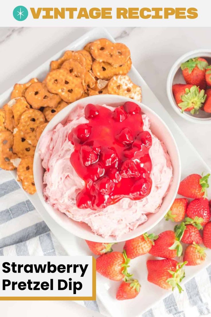 strawberry pretzel dip in a white bowl surrounded by cookies and strawberries