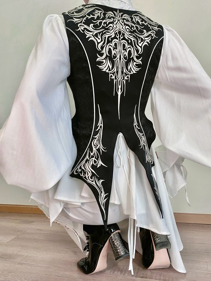 Featuring a deep V-neck that adds a touch of sophistication, this waistcoat is adorned with gorgeous embroidery that showcases expert craftsmanship. The front zip closure ensures a secure fit while maintaining a sleek silhouette. Perfect for creating a polished, aristocratic look, this waistcoat is a must-have for any Lolita fashion enthusiast.   	 		 			Size 			XS 			S 			M 			L 		 		 			Bust 			80 			84 			88 			92 		 		 			Waist 			64 			68 			72 			76 		 		 			Full Length 			68.5 			69.5 Womens Tailcoat, Punk Tops, Kawaii Hoodies, Steampunk Fashion Male, Shopping Link, Fashion Corset, Gothic Skirts, Casual Goth, Dark And Mysterious