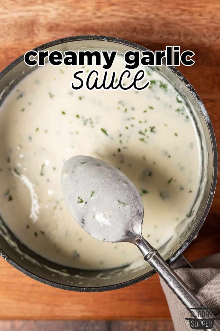 creamy garlic sauce in a bowl with a spoon on the side and text overlay that reads, creamy garlic sauce