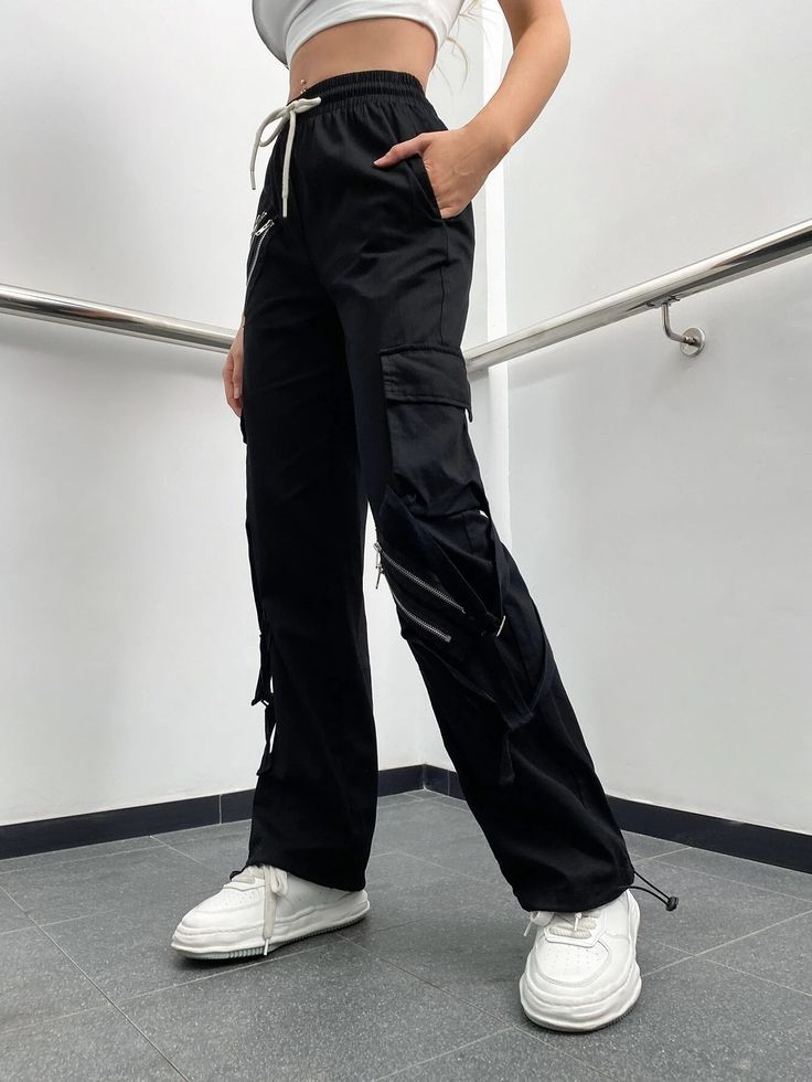 Make a fashion statement with these Zipper Detail Drawstring Cargo Pants. These pants feature a drawstring waist for a comfortable fit and zipper details that add a touch of edgy style. The combination of functionality and fashion makes them a versatile choice for various occasions. Whether you're going for a casual or street-style look, these zipper detail drawstring cargo pants will elevate your outfit. Specifications: Style: Casual Type: Cargo Pants Details: Drawstring, Pocket, Zipper Waist L Straight Leg Pants With Zipper Pocket For Streetwear, Trendy Straight Pants With Zipper Closure, Trendy Streetwear Pants With Zipper Closure, Trendy Trousers With Zipper Closure, Urban Parachute Pants With Zip Fly For Streetwear, Urban Wide Leg Bottoms With Zipper Closure, Straight Leg Bottoms With Zipper Pocket For Streetwear, Casual Black Pants With Zipper Pocket, Urban Streetwear Pants With Zipper Closure