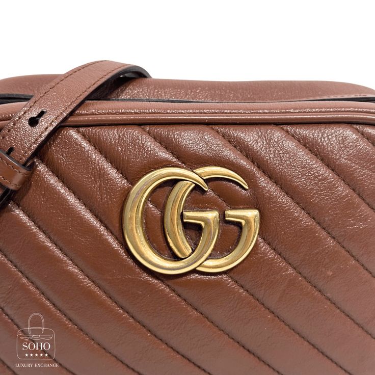 Pre-Owned Gucci Crossbody Brown Diagonal Quilted Matelasse Leather Antiqued gold-toned and double GG torchon logo hardware Adjustable chain link strap with leather shoulder guard Top Zip Closure Interior lining neutral faux suede with slip pocket Guaranteed Authentic. Condition: 7.5/10 Good. Light marks to exterior. Loss of shape to top zipper area. Moderate stains/marks to interior. Details: Height: 5.5" Width: 9.5" Depth: 2.75" Shoulder Strap Drop: 22" Classic Gold Shoulder Bag With Logo, Designer Gold Shoulder Bag With Logo Hardware, Formal Brown Shoulder Bag With Gold-tone Logo Plaque, Classic Gold Bags With Logo Plaque, Designer Gold Shoulder Bag With Logo Plaque, Gold Shoulder Bag With Logo Hardware, Elegant Gold Shoulder Bag With Logo, Elegant Brown Shoulder Bag With Metal Logo, Brown Formal Bags With Logo Plaque