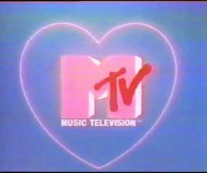 the logo for music television is displayed in front of a blue background with a pink heart