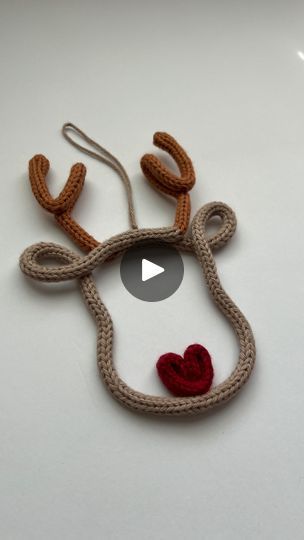 an ornament made to look like a reindeer's head with a heart on it