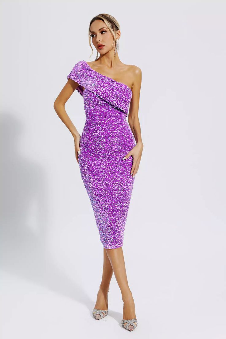 Our Alexandria Purple Sequin Midi Dress is sure to wow the crowd at your next special event! Featuring slanted shoulders, sequins, and detailing, this dress shines effortlessly. The skirt falls to the knee, perfect for showing off calves. This dress is perfect for weddings, parties, proms, and more! Just need to match a pair of high heels.  Dress Length: Approx 114cm Materials: Sequin Gentle Dry Clean Only  Model is 5 ft 7 and wears size S  Colour may vary due to lighting on images. The product Purple Dress Midi, Glitter Wedding Dress, Robes Glamour, Sequin Dress Short, Midi Party Dress, Heels Dress, Purple Midi Dress, Sequin Midi Dress, Bandage Midi Dress