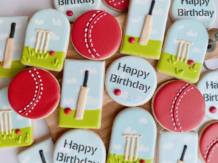 decorated cookies are arranged on a table for a birthday