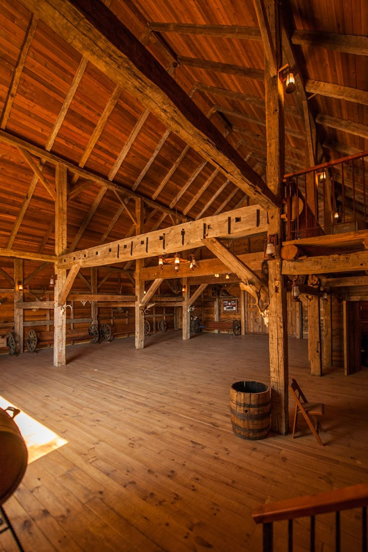 the inside of an old barn with wooden floors