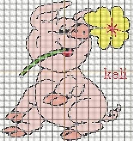 a cross stitch pattern with a teddy bear holding a flower in it's mouth