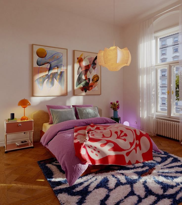 a bed room with a neatly made bed and paintings on the wall