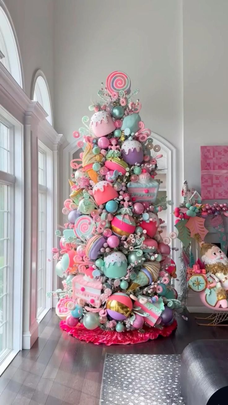 a brightly colored christmas tree in the corner of a living room with pink and green decorations