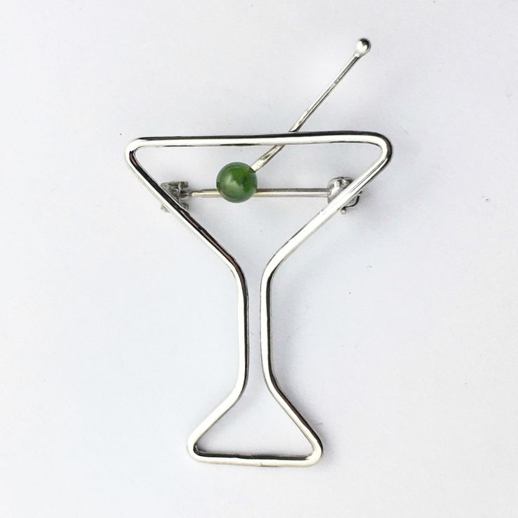 "This martini brooch is made of sterling silver with a round Peridot gemstone olive. It measures 2\" inch long with a width of 1 1/4\" inch. Handmade in the USA." Green Sterling Silver Brooches For Gifts, Green Sterling Silver Brooches As Gifts, Green Sterling Silver Brooch For Gift, Modern Sterling Silver Brooch For Gift, Sterling Silver Brooch, Silver Pin, Peridot Gemstone, Silver Brooch, Martini Glass