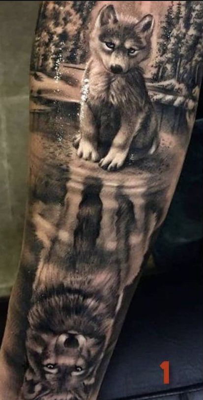 a man's arm with an animal tattoo on it