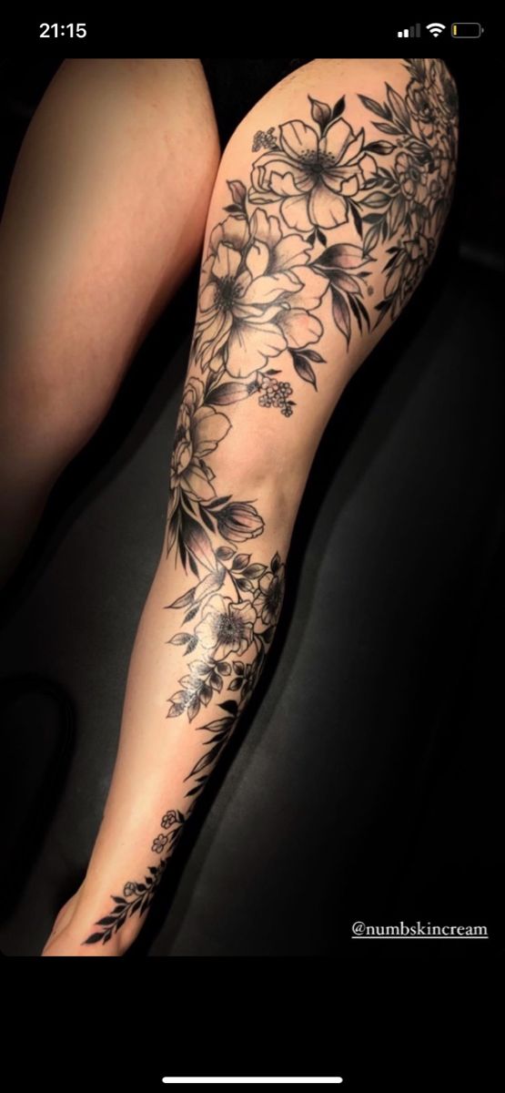 a woman's leg with flowers on it