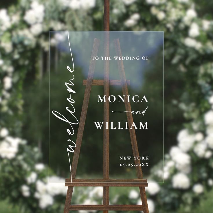 an easel with the words monica and william written on it