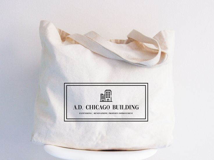 a white tote bag with the words ad chicago building on it sitting on top of a table