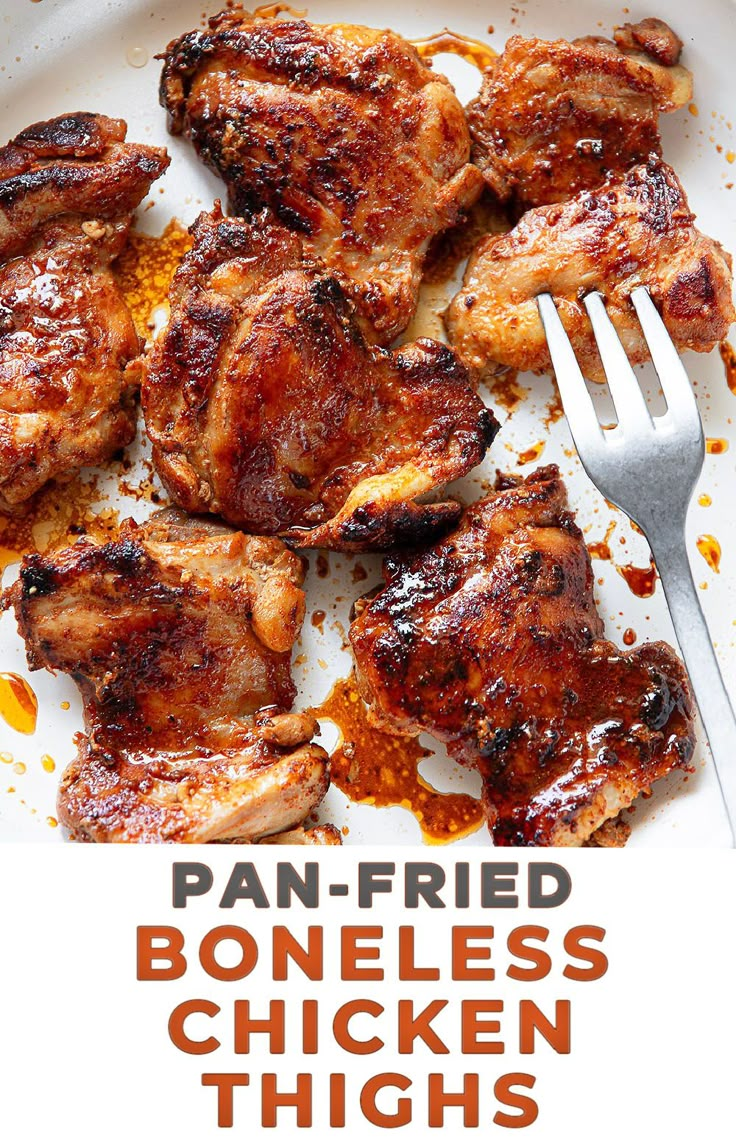 pan fried boneless chicken thighs on a white plate with a fork and text overlay that reads, pan - fried boneless chicken thighs