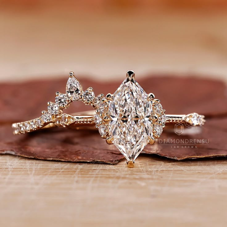 a close up of a diamond ring on a leaf