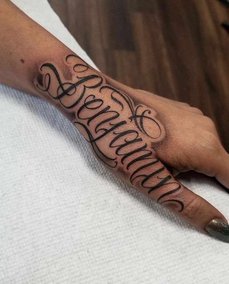 a person's hand with a tattoo on it and the word savannah written in cursive writing