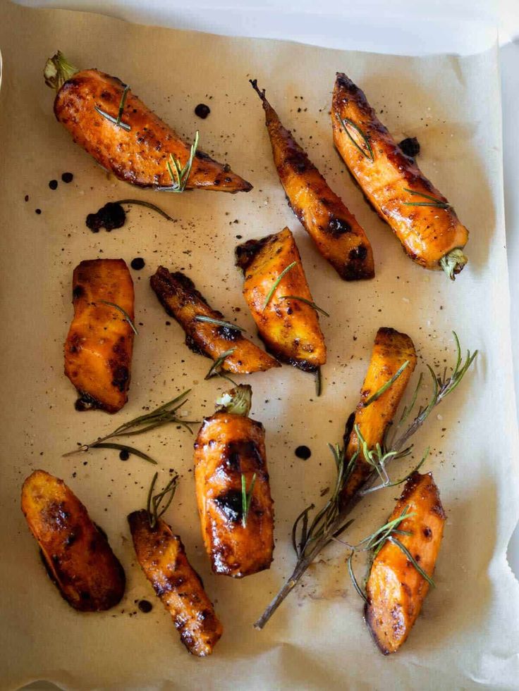 grilled chicken with herbs and spices on a sheet of parchment paper, ready to be served