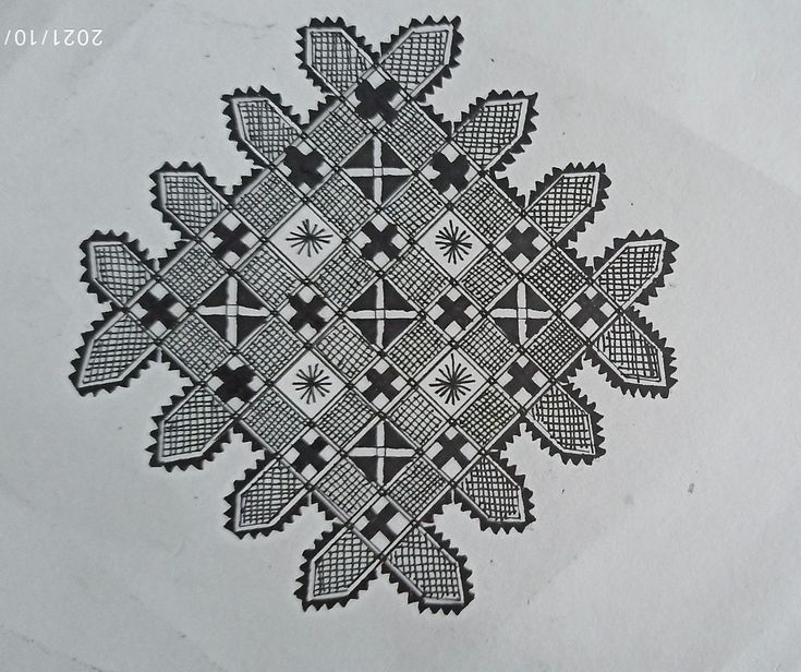 a black and white drawing of a snowflake