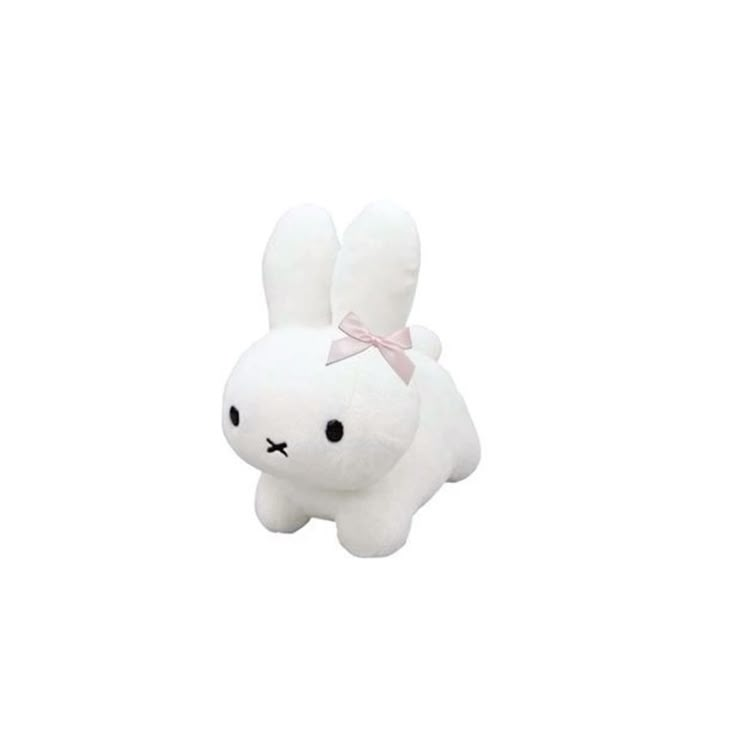 a white stuffed animal with a pink bow on it's head, sitting in front of a white background