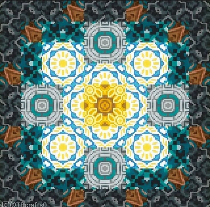 an image of a cross stitch pattern in blue, yellow and grey colors with the center surrounded by smaller circles