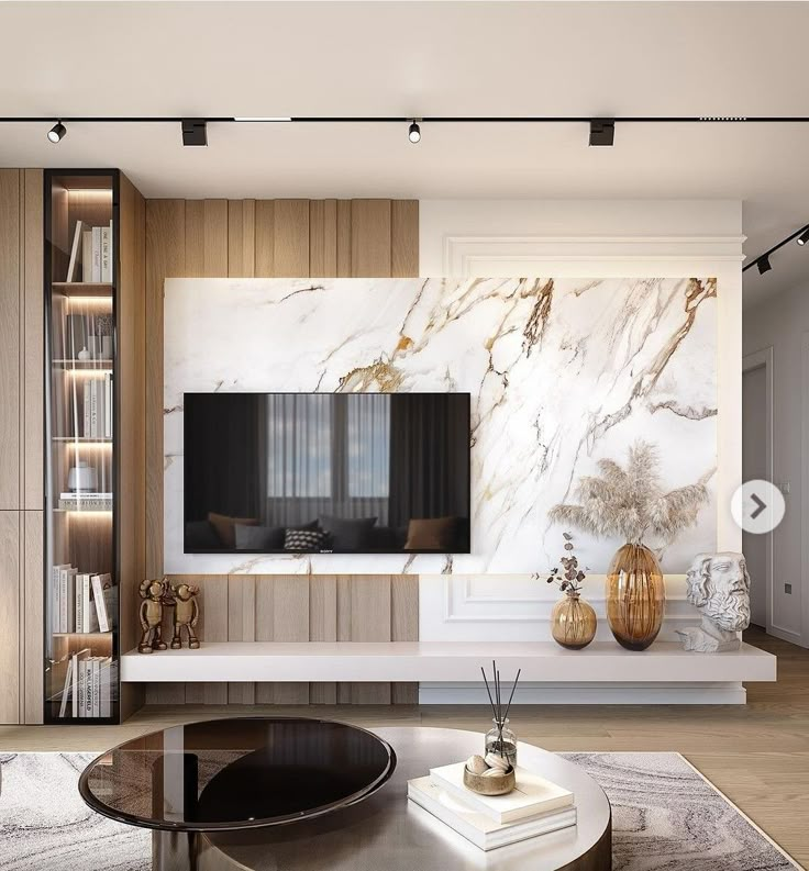 a modern living room with marble walls and furniture in the center, along with a large tv mounted to the wall