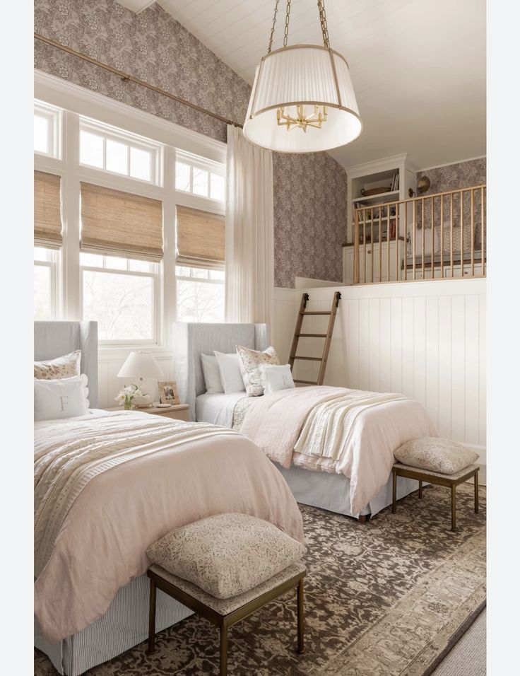 a bedroom with two beds and a ladder hanging from the ceiling above them, along with a rug on the floor