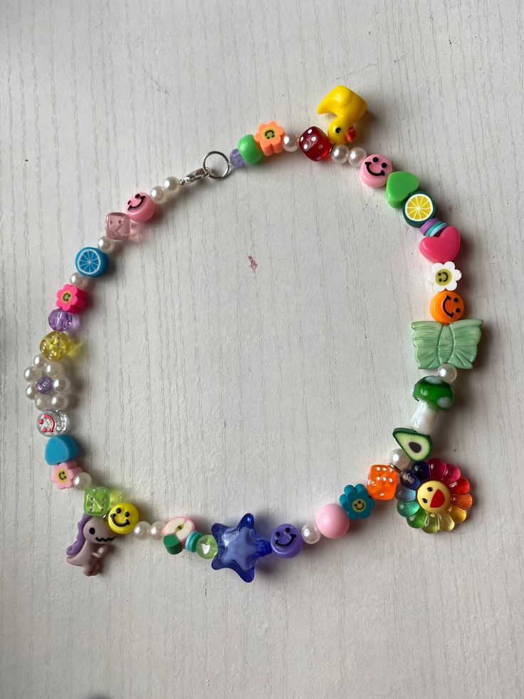 a bracelet with colorful beads and charms on it