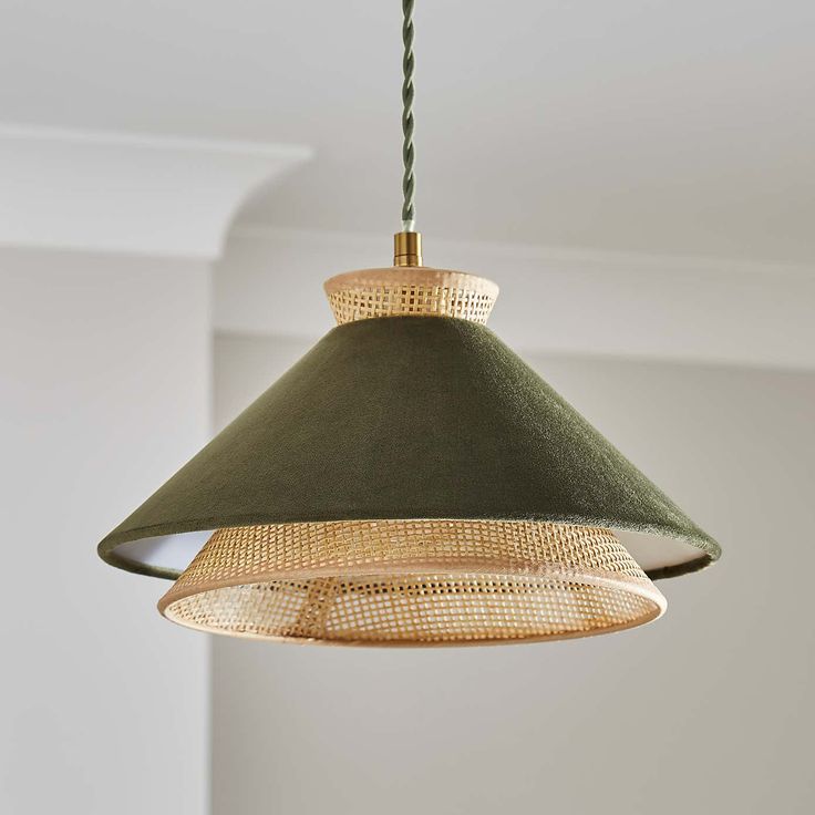 a green lamp hanging from the ceiling