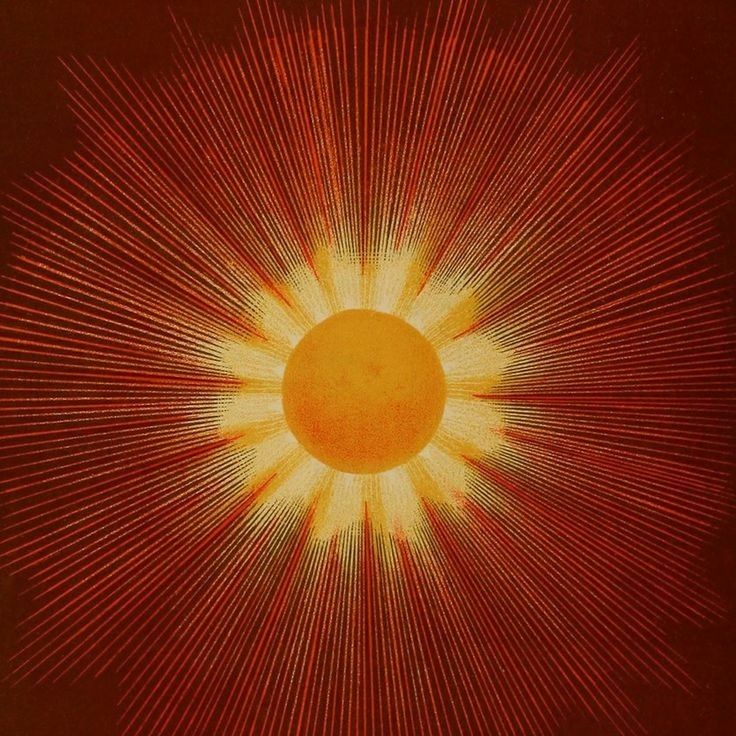 an orange and yellow sunburst with red rays