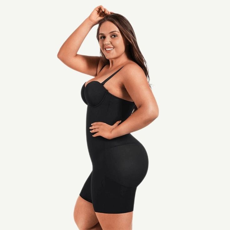 This stunning ultra-versatile bodysuit is simultaneously tight-fitting, functional, and stylish. The mid section contours gently to your unique curves while the low-back styling give a clean luxury look and feel. The built-in slimming compression with the elastic tulle cutout in the tummy enhances the slimming effect, fitting comfortably while not squeezing. Skin-friendly design for tummy control and leg contour. Elegant Solid Color Push-up Shapewear, Elegant High Stretch Bodysuit With Built-in Bra, High Stretch Underbust Shapewear With Built-in Bra, Fitted Bodysuit With Built-in Bra, Fitted Solid Bodysuit With Built-in Bra, Fitted Solid Color Bodysuit With Built-in Bra, Elegant Underbust Smoothing Shapewear, Sleek Fitted Bodysuit With Underwire, High Stretch Solid Color Backless Shapewear