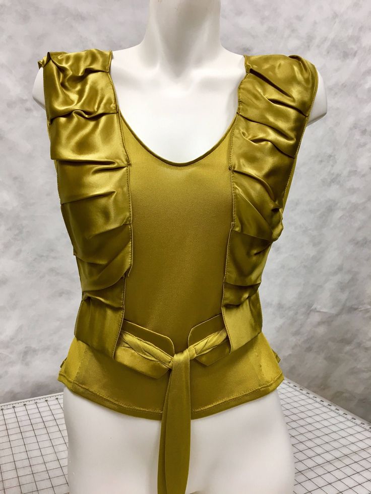 Golden mustard color silk jersey and charmeuse top.  100% silk.  Wide shoulder silk jersey tank top with draped silk charmeuse harness straps that hold braided belt.  Incredibly soft and luxurious fabrics and rich vibrant color.  Soft shape.  Available 2 only in sizes 6 and 8.  Ask us about final sale discount option. Celine Top, Fashion Classic Style, Silk Tops, Yellow Silk, Gowns For Girls, Braided Belt, Jersey Tank Top, Mustard Color, Womens Tank Tops