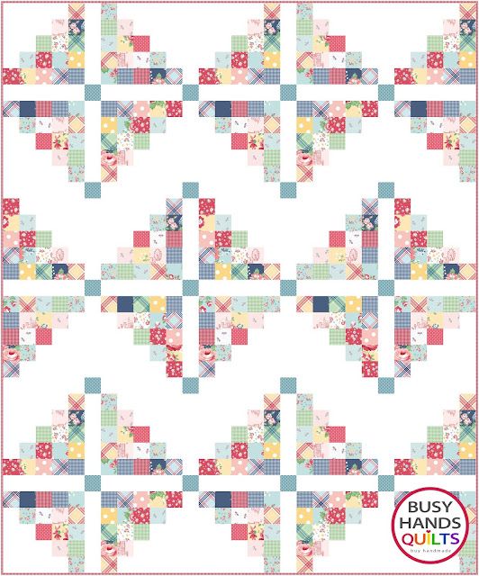 a quilt pattern with squares and flowers on the front, in pastel colors that appear to be made from fabric