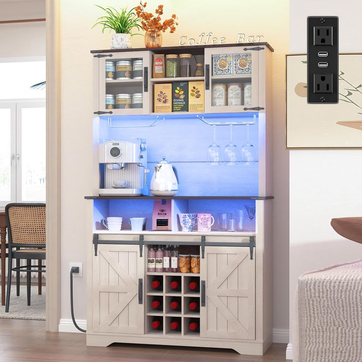 a kitchen area with a refrigerator, coffee maker and other items