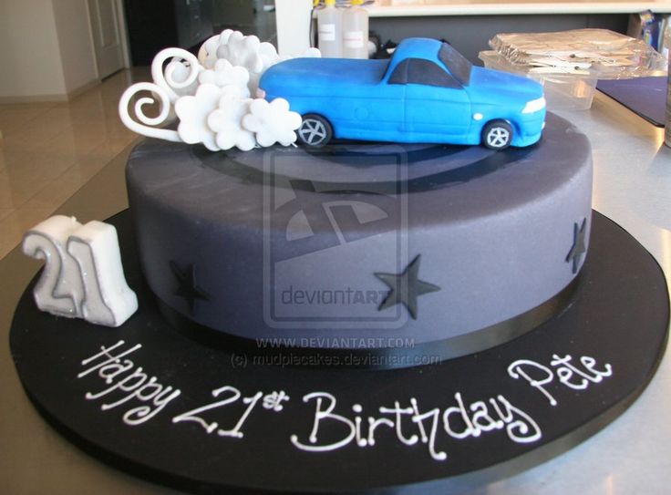 a birthday cake with a blue car on top