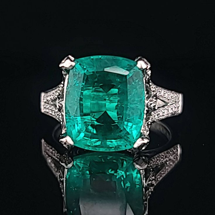 GORGEOUS 18K WHITE GOLD DIAMOND AND COLOMBIAN EMERALD RING IN CUSHION SHAPE CENTER 5.67 CARAT SIZE 12x10 CENTER EMERALD center lab treated Flux Growth EMERALD COLOMBIA BERYL EMERALD GORGEOUS COLOMBIAN EMERALD AAA RATED!! VERY CLEAN ,VERY NICE CUT ,AMAZING BRILLIANCE FULL OF FIRE, side round natural diamonds 0.50ct. SI1 quality H- COLOR size 6.5 Retail value $9,500 net . Appraisal available Luxury Gia Certified Platinum Gemstones, Luxury Gia Certified Diamond Gemstones, Luxury Gia Certified Gemstones, Luxury Gia Certified Emerald Gemstones, Luxury Brilliant Cut Platinum Gemstones, Luxury Oval Platinum Gemstones, Classic Platinum Gemstones Gia Certified, Luxury White Gold Gia Certified Gemstones, Luxury Emerald Birthstone Ring