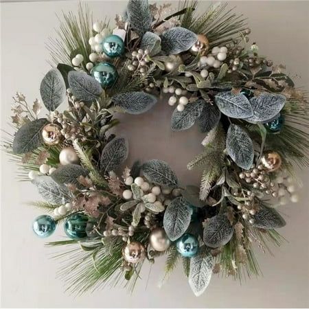 a christmas wreath is hanging on the wall