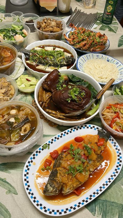 a table topped with lots of different types of dishes and bowls filled with food next to each other