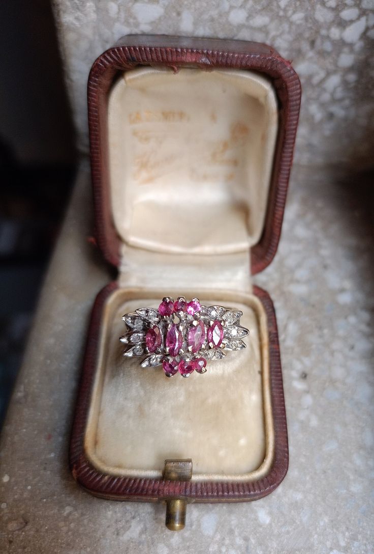 Metal : tested positive for Palladium Main gemstone: Ruby and diamond. Quantity of rubíes: 10 Cut: marquise and round cut Diamond: Quantity: 10 diamonds  Total diamond carat weight: 0.6 carats  Ring size: 7 Ring weight: 4.7 gr Stamped : no but we guarantee It Circas : 50's approx Formal Ruby Ring With Diamond Accents In Cluster Shape, Formal Cluster Ruby Ring With Diamond Accents, Classic Marquise Ruby Ring With Brilliant Cut, Diamond Cluster Ruby Ring With Diamond Accents, Marquise Ruby Ring With Diamonds, Marquise Ruby Ring With Center Stone For Promise, Classic Marquise Ruby Ring With Center Stone, Formal Marquise Ruby Ring With Diamond, Marquise Cut Ruby Diamond Ring With Prong Setting