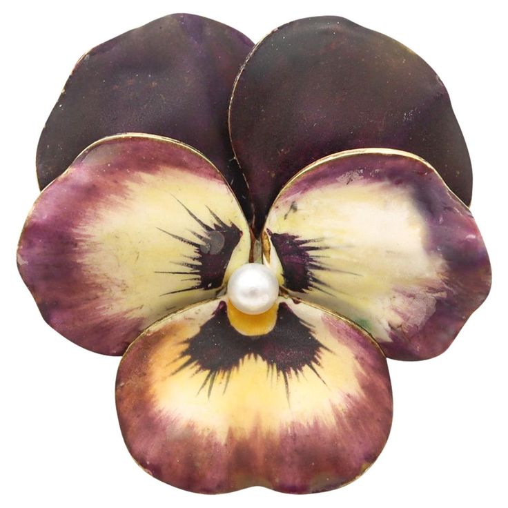 Art nouveau Pansy flower pendant brooch designed by A.J. Hedge & Co. A colorful pendant-brooch, created in America during the Edwardian and the Art Nouveau periods, back in the 1900. This piece is very unique and has been carefully crafted by A.J. Hedge & Co in the shape of a pansy flower in solid yellow gold of 14 karats with satin and polished finishes. It is embellished with a white pearl and applications of non-glossy powder enamel, with colors gradations of dark purple, purple, white and a Bijoux Art Nouveau, Pansy Flower, Andrew Jackson, Pendant Brooch, Edwardian Jewelry, Pansies Flowers, Common Themes, Art Nouveau Jewelry, Arts And Crafts Movement