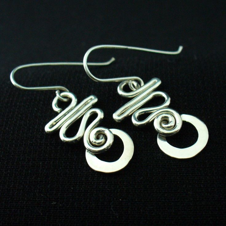 These earrings are hand crafted in solid sterling silver.I use 16 gauge wire for these so they're nice and light but not flimsy.For a unique,long lasting and clearly handmade pair of everyday dangles that won't break the bank.These will do the trick. Modern Adjustable Sterling Silver Wrap Earrings, Hypoallergenic Spiral Sterling Silver Jewelry, Handmade Spiral Sterling Silver Wrap Earrings, Spiral Sterling Silver Pierced Earrings, Unique Silver Plated Wire Earrings With Ear Wire, Modern Sterling Silver Nickel-free Wrap Earrings, Sterling Silver Drop Wrap Earrings, Unique Silver Plated Wire Earrings, Silver Sterling Silver Drop Wrap Earrings