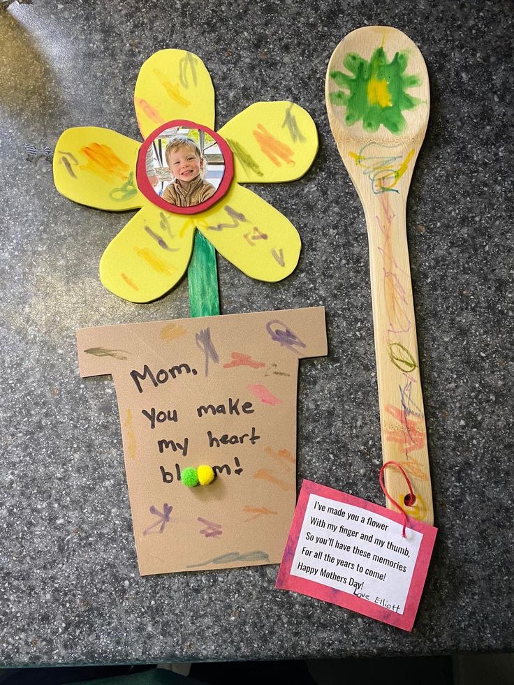 a mother's day card, spoon and flower